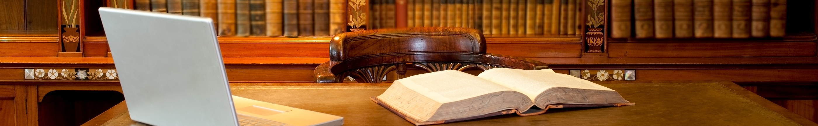 book and laptop in boardroom